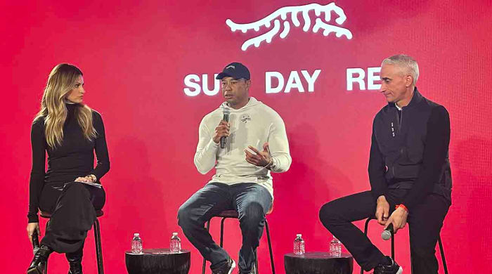 Tiger Woods announces his new Sun Day Red brand on Monday, Feb. 12, with host Erin Andrews and TaylorMade CEO David Abeles.